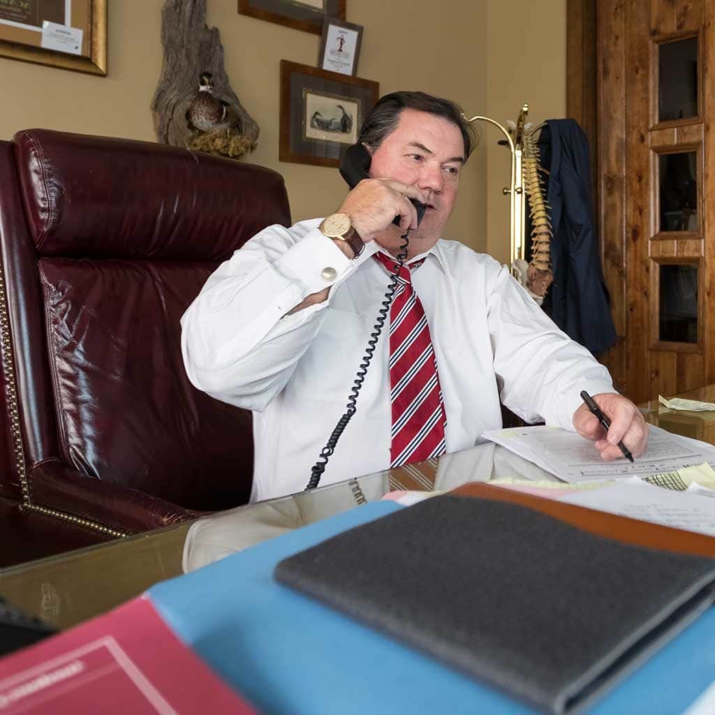 James Domengeaux Lafayette Louisiana Wright Roy Personal Injury Attorney on phone with no jacket on