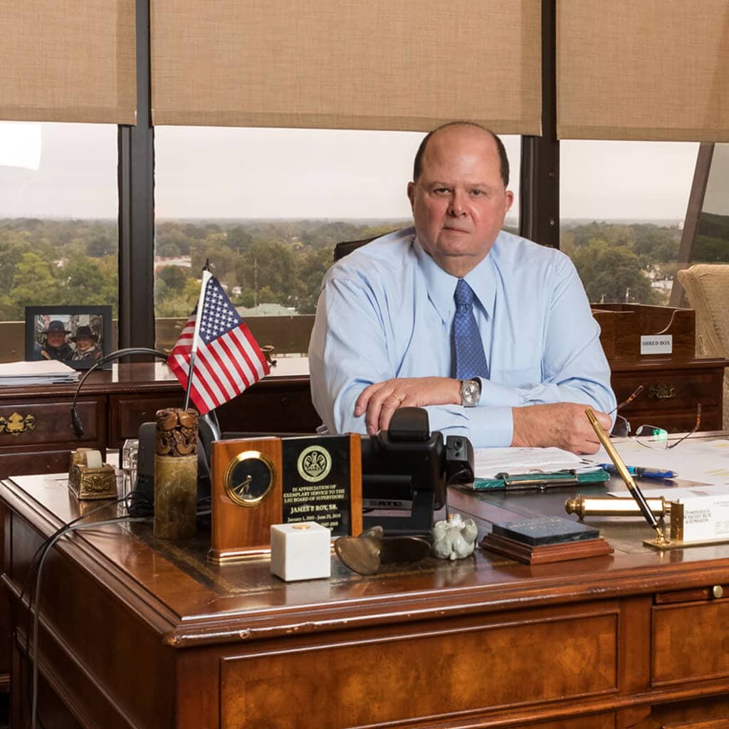 James Roy Lafayette Louisiana Personal Injury Attorney seated in his office overlooking downtown lafayette louisiana
